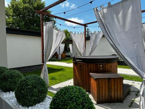 a gazebo with a hot tub in a yard at WRZOS resort & wellness in Węgierska Górka