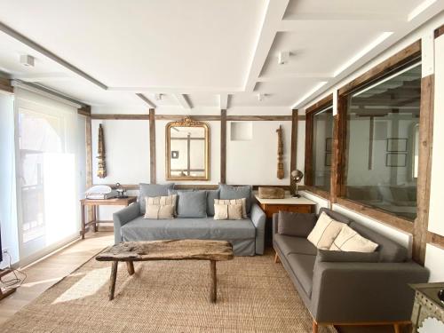 a living room with a couch and a table at Apartamentos Principe 7 in Madrid