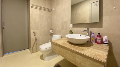a bathroom with a sink and a toilet and a shower at Fairlane Residence at Bukit Bintang in Kuala Lumpur