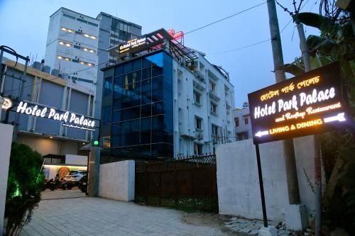a hotel parking sign in front of a building at HOTEL PARK PALACE AND ROOFTOP RESTAURANT in Guwahati