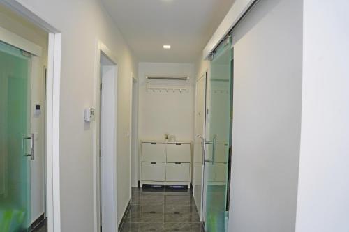 a bathroom with a walk in shower and a sink at Sobol Apartments 'Navis' with private jacuzzi in Crikvenica
