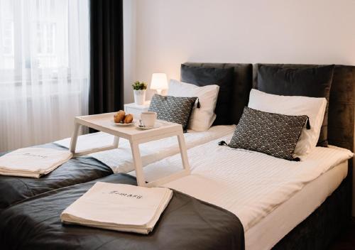 Posteľ alebo postele v izbe v ubytovaní Memory Apartments