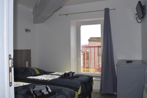 Postel nebo postele na pokoji v ubytování Gîte le Grenier