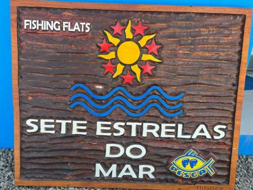 a sign that says fishling hats seete extremists do mar at FLATS SETE ESTRELAS DO MAR in Ilhéus