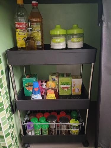 a shelf in a refrigerator filled with lots of food at apartamento 3 corazones in Punta Umbría