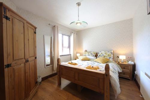 a bedroom with a bed and a window at Cloyfin B and B in Coleraine