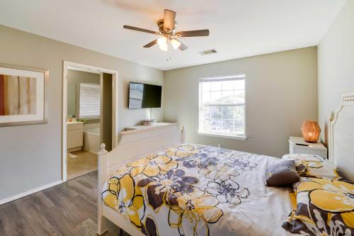 a bedroom with a bed and a ceiling fan at Home with Game Room and Hot Tub, 1 Mi to SeaWorld in San Antonio