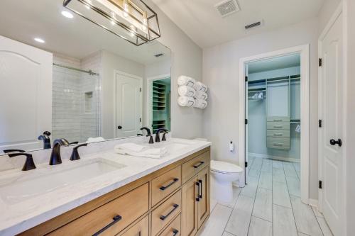 a bathroom with a sink and a toilet at Fruit Cove Vacation Rental with Private Hot Tub! in Fleming Island