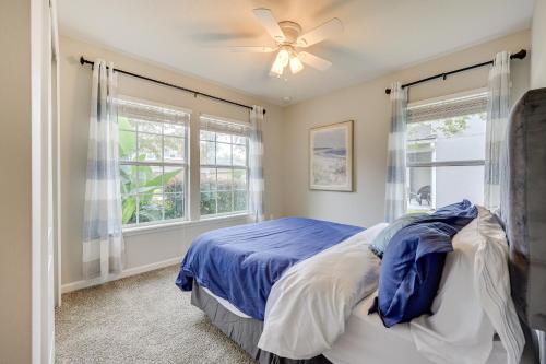a bedroom with a bed and a ceiling fan at Fruit Cove Vacation Rental with Private Hot Tub! in Fleming Island