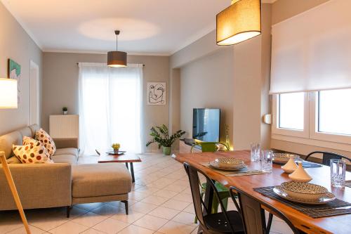 a living room with a dining table and a living room at Chios BnB in Chios