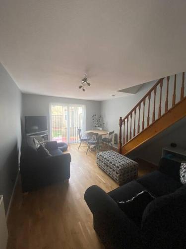 a living room with a couch and a table at Family Home In The Forest Of Dean in Coleford