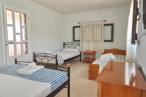 Postel nebo postele na pokoji v ubytování Villa Rania / Zante Drosia