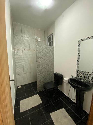 Ванная комната в Pousada econômica bon vivant arraial do cabo