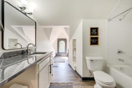 a bathroom with a toilet and a sink and a tub at Chic and Historic Apartment about 6 Mi to Louisville! in New Albany