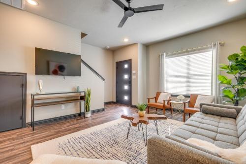a living room with a couch and a tv at Newly Built Corner Hideaway 3 Mi to Texas A and M in College Station