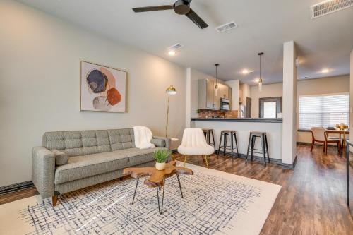 a living room with a couch and a table at Newly Built Corner Hideaway 3 Mi to Texas A and M in College Station