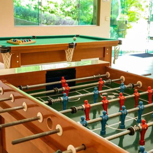 a set of billiard tables in a room at Recanto dos Beija Flores, Chalé lantana a in Monte Alegre do Sul