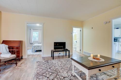a living room with a coffee table and a piano at Peaceful Saint Germain Home with Fire Pit! in Saint Germain