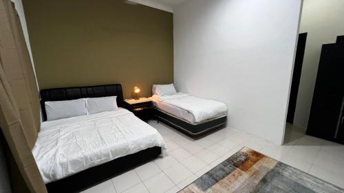 Ένα ή περισσότερα κρεβάτια σε δωμάτιο στο Rerama Room Stay Langkawi