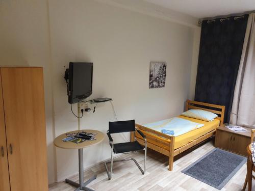 En eller flere senge i et værelse på Monteurzimmer Fuchs-Kupke