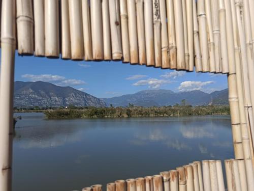 a view of a lake through a window at Holiday house - Leo & Malù in Sarnico