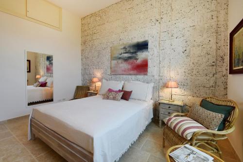 Postel nebo postele na pokoji v ubytování Villa Tozzoli 'Top' Floor