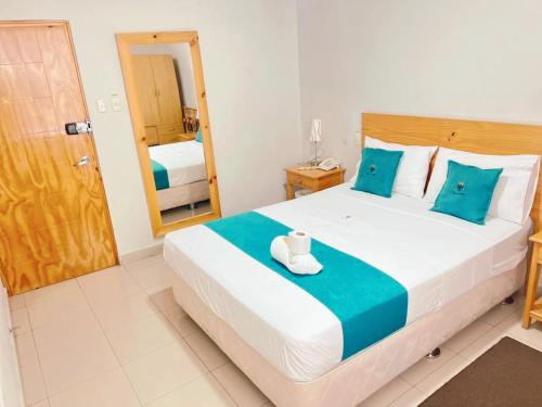 Postel nebo postele na pokoji v ubytování Hotel Reycer