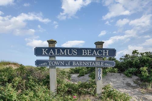 a street sign for kalamius beach and town of barnstable at Renovated & Sophisticated Home Near Beach & Shops! in Barnstable