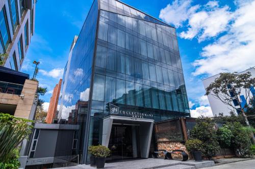 a glass facade of a building in a city at GHL Collection 93 in Bogotá