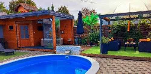 a backyard with a swimming pool and a gazebo at "Oasis of Peace Zagreb-Apartments" in Zagreb