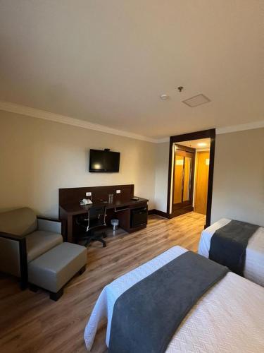 Ένα ή περισσότερα κρεβάτια σε δωμάτιο στο Aeroporto Hotel Congonhas UH-114