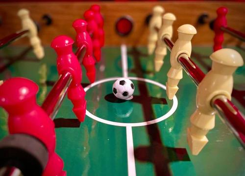 a game of chess with a soccer ball on a table at Zen Spa Oasis Retreat Sauna/Hotub/Firepit/Fun/Gameroom in Blakeslee