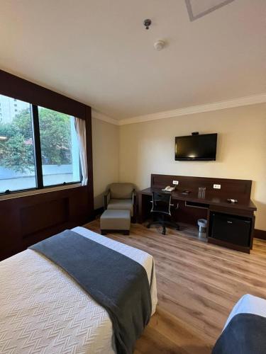 Ένα ή περισσότερα κρεβάτια σε δωμάτιο στο Aeroporto Hotel Congonhas UH-114