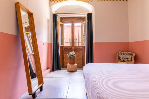 Postel nebo postele na pokoji v ubytování Selina Oaxaca