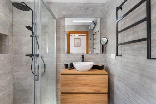 a bathroom with a sink and a shower at Villa Reva - PlusHolidays in Calpe