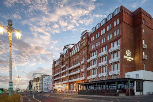 a building on a city street with a street light at DoubleTree By Hilton Brighton Metropole in Brighton & Hove