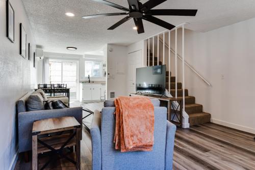 a living room with two blue chairs and a ceiling fan at Modern Retreat near UofO, Autzen Stadium, Amazon Park #2 in Eugene
