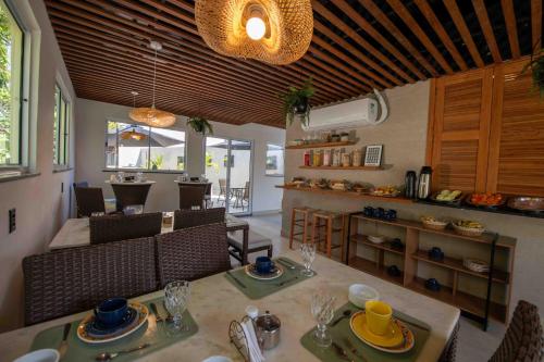 a kitchen and living room with a table and chairs at Leblon Design Hotel in Rio de Janeiro