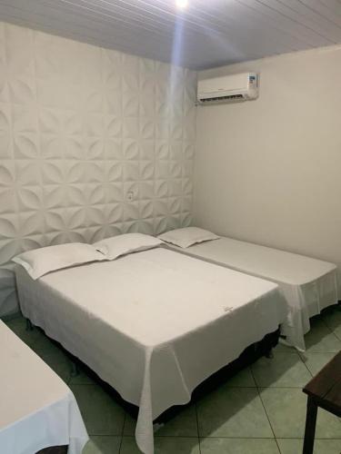 Ένα ή περισσότερα κρεβάτια σε δωμάτιο στο Hotel Imigrantes - Várzea Grande