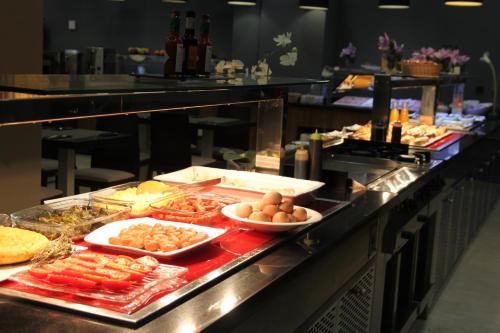 a buffet line with many different types of food at DWO Urban Granada in Granada