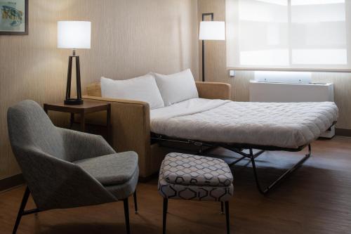 a living room with a couch and a chair at Four Points by Sheraton Bellingham Hotel & Conference Center in Bellingham