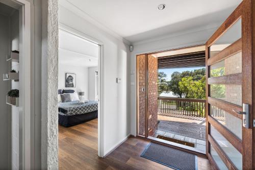 a view from the hallway of a house with a balcony at Valentine Sandcastles in Rye