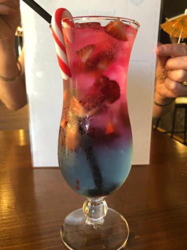 a drink with fruit in a glass on a table at Club Hotel Warragul in Warragul