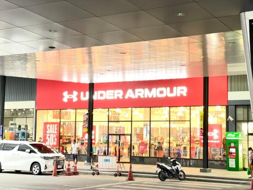 a store with a motorcycle parked in front of it at Impact Arena C3 Milo in Nonthaburi
