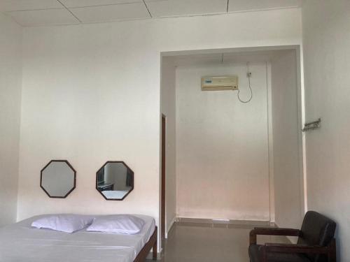 Ένα ή περισσότερα κρεβάτια σε δωμάτιο στο Hotel Surya Citra Jogja A Mitra RedDoorz