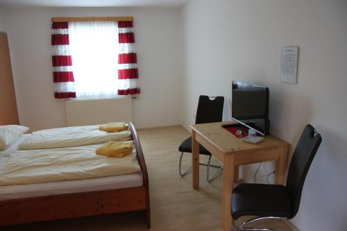 Cama o camas de una habitación en Pension Merkinger