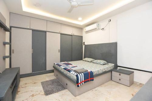 a bedroom with a bed and a tv in it at Family&PetFriendly 5BHK With Jacuzzi @BanjaraHills in Hyderabad