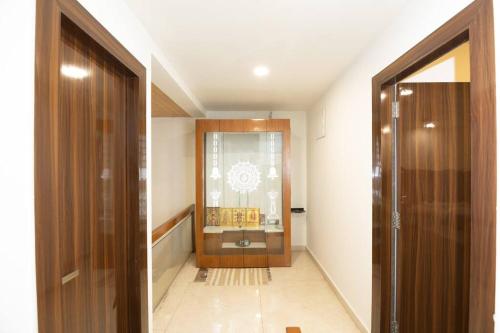 a hallway with a door leading to a room at Family&PetFriendly 5BHK With Jacuzzi @BanjaraHills in Hyderabad
