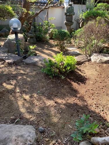 Un jardín fuera de Luxury Japanese Villa with Garden Near Kansai Airport & Premium Outlets 和風庭園豪邸
