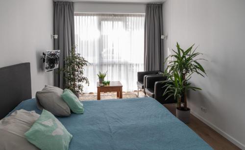 Ένα ή περισσότερα κρεβάτια σε δωμάτιο στο Buitenplaats Wergea